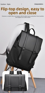 Detail of waterproof black backpack showing large flap design and metal buckle straps