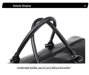 Detail of round padded handles and litchi texture on black leather travel bag
