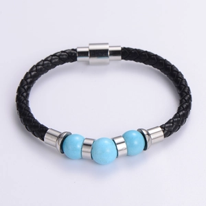 Detail of black braided leather bracelet with sky blue beads and silver magnetic clasp