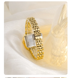 Detailed side view of luxury gold square watch with stainless steel five-link strap