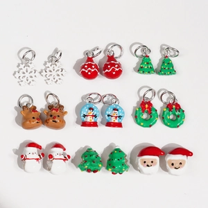 Christmas charms and beads collection featuring Santa Claus, reindeer, and snowflakes