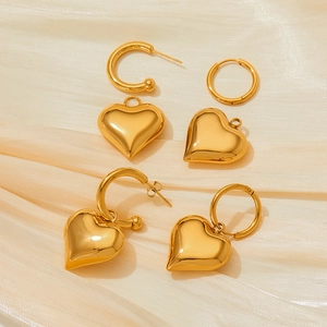 Chic 18K gold plated stainless steel hoop earrings with 3D puffy heart charms on silk
