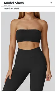 Detailed model show of seamless black ribbed yoga set featuring tube top and high waist leggings