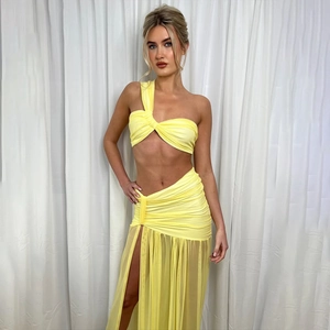 Sexy yellow two-piece set for women featuring one-shoulder top and high slit mesh skirt