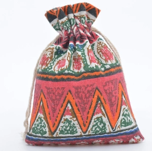 Detailed close-up of a floral cotton linen drawstring pouch with ethnic geometric prints