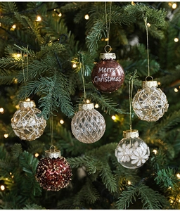 Detailed close-up of 5cm Christmas ball ornaments hanging on a tree with warm golden lights
