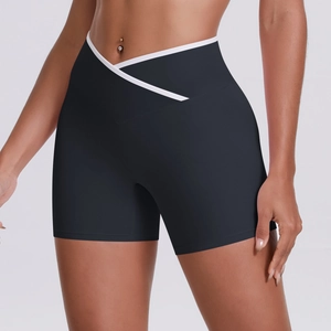 Detail of high waist yoga shorts featuring cross V-shape waistband and white trim