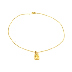 Detail of cute gold gummy bear pendant on delicate bead chain with lobster clasp
