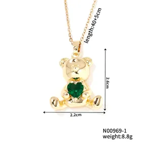 Detail view of golden bear pendant with green heart zircon and measurement dimensions