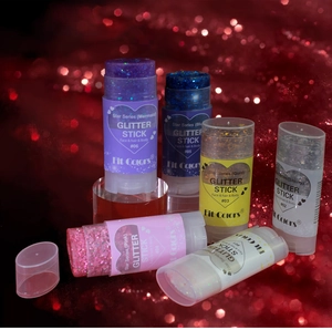 Detailed view of six colors of glitter sticks for face and body makeup in vibrant shades
