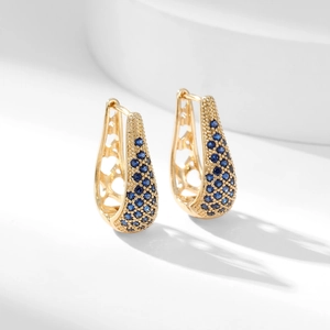 Elegant gold U-shaped hoop earrings with blue pavé crystals and heart cutout detail