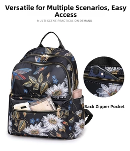Detail of waterproof black backpack with daisy and hummingbird prints and anti-theft back pocket