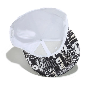 Detail of white cotton flat brim hat with graffiti print under visor and care label