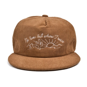 Detail of embroidered cactus and text on brown corduroy flat brim baseball cap