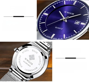 Detail of blue sunray dial with calendar and stainless steel back of men's quartz watch
