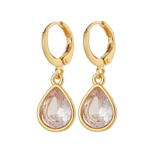 Detail of gold water drop huggie hoop earrings with transparent teardrop crystal