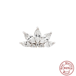 Macro detail of S925 sterling silver paw print stud earring with shiny cubic zirconia stones