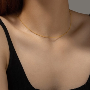 Elegant gold S925 sterling silver satellite chain necklace shown on neck