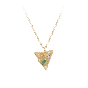 Macro detail of golden triangle pendant featuring colorful gemstones and radial texture