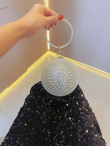 Sparkling silver sphere evening clutch bag with rhinestone ring handle for elegant parties
