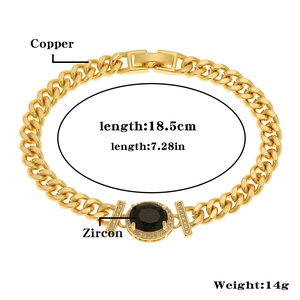 Detail view of 18.5cm gold cuban link bracelet with black zircon and diamond accents