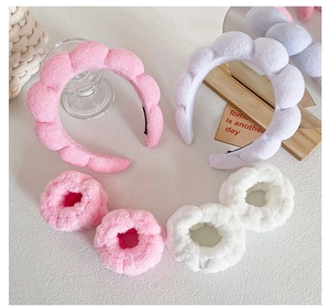 Detailed plush spa headband and wristband set in pink and purple colors