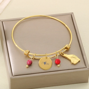 Detail of adjustable gold bangle with red beads and I Love You heart pendant