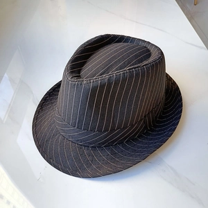 Detail of black pinstripe fedora hat with white stitching on high-quality twill fabric