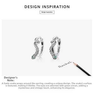 Detailed macro view of S925 sterling silver snake earrings with green zircon eyes