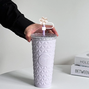 White quilted plastic tumbler with purple straw and 10mm flower straw cover topper