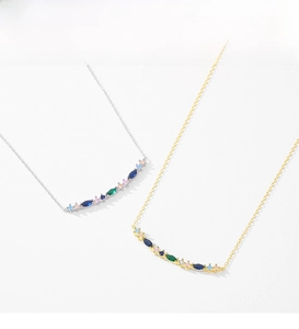 Detail of S925 sterling silver necklaces with colorful marquise-cut gemstone rainbow pendants