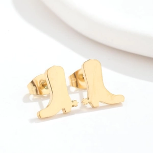 Detail view of golden cowboy boot stud earrings in polished stainless steel