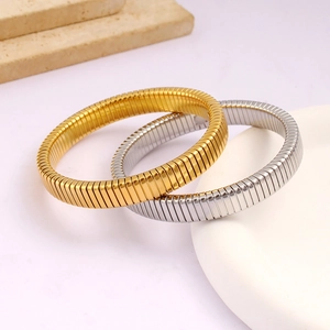 Detailed close-up of gold and silver polished Tubogas style stretch bracelets