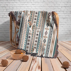 Detailed texture of bohemian knitted throw blanket with geometric patterns and fringe