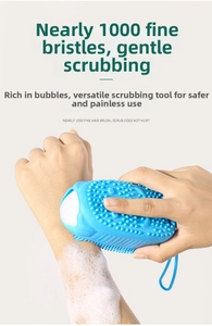 Blue silicone bath brush with double-sided bristles and dense foam on skin