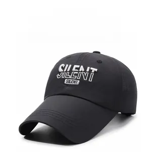Close-up of SILENT white 3D embroidery on a black quick-dry baseball cap with curved visor