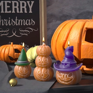 Handmade Halloween pumpkin candles with wizard hats and festive decorations