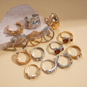 Chic 7-piece metallic resin ring set with crystal accents and irregular lava texture