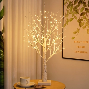 Birch LED decorative tree with warm light in cozy living room setting for holiday