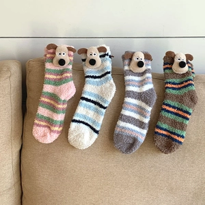 Detailed view of striped coral fleece socks featuring 3D cartoon dog character details