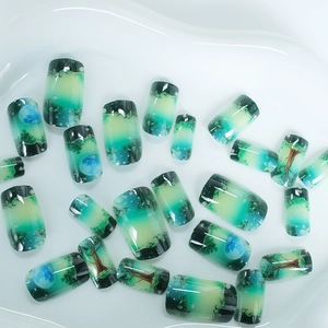 Forest and starry sky themed green press-on nails with 24 pieces in a set