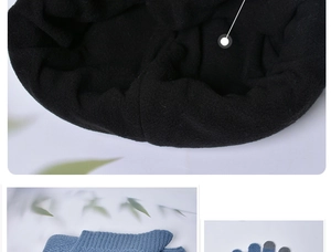 Detail of blue knitted gloves with touchscreen tips and thick black fleece lining