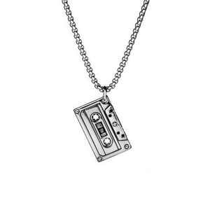 Close-up of vintage cassette tape pendant and textured industrial chain link detail