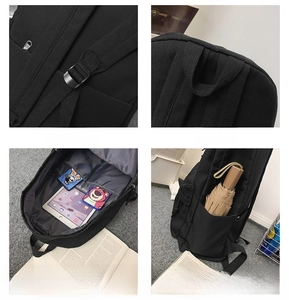 Detail view of black backpack with adjustable straps, inner compartments and side pocket