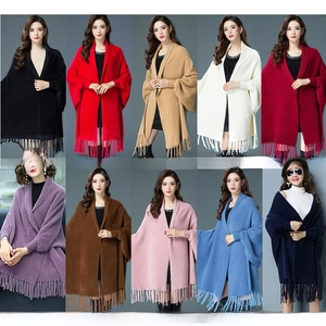 Multiple color options for the knitted faux mink shawl poncho with fringe detail