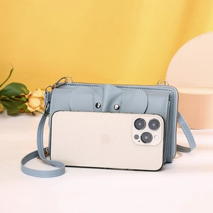 Detail of light blue elephant crossbody phone bag showing cute ears and slim strap