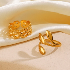 18K gold-plated stainless steel leaf and chain open rings set on a silk background