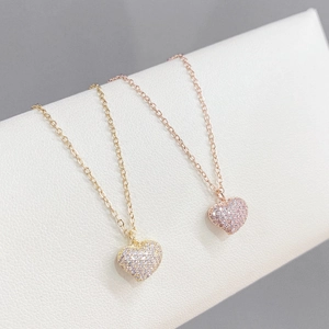 Minimalist heart pendant necklace in gold and rose gold with micro-paved sparkling crystals