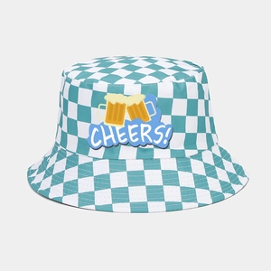 Detail of blue and white checkered Oktoberfest bucket hat with Cheers beer graphic