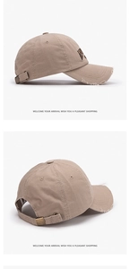Detail of khaki distressed baseball cap with side embroidery and metal buckle strap